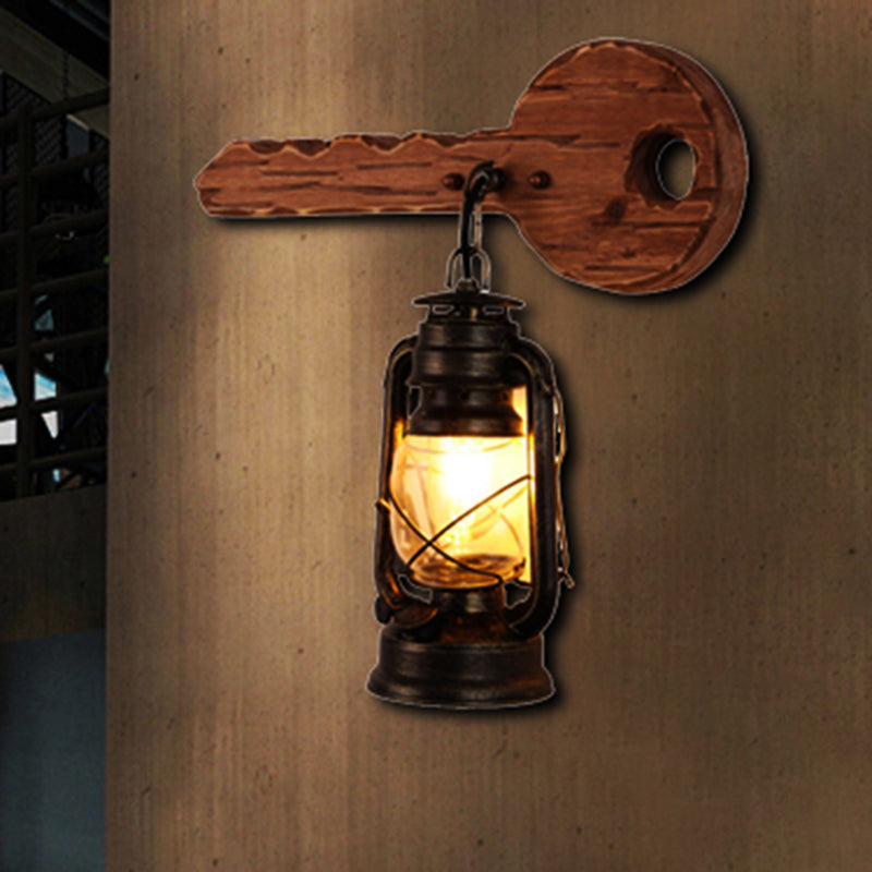 Antiqued Kerosene Wall Sconce With Clear Glass And Wood Leaf/Key Backplate For Dining Room Lighting