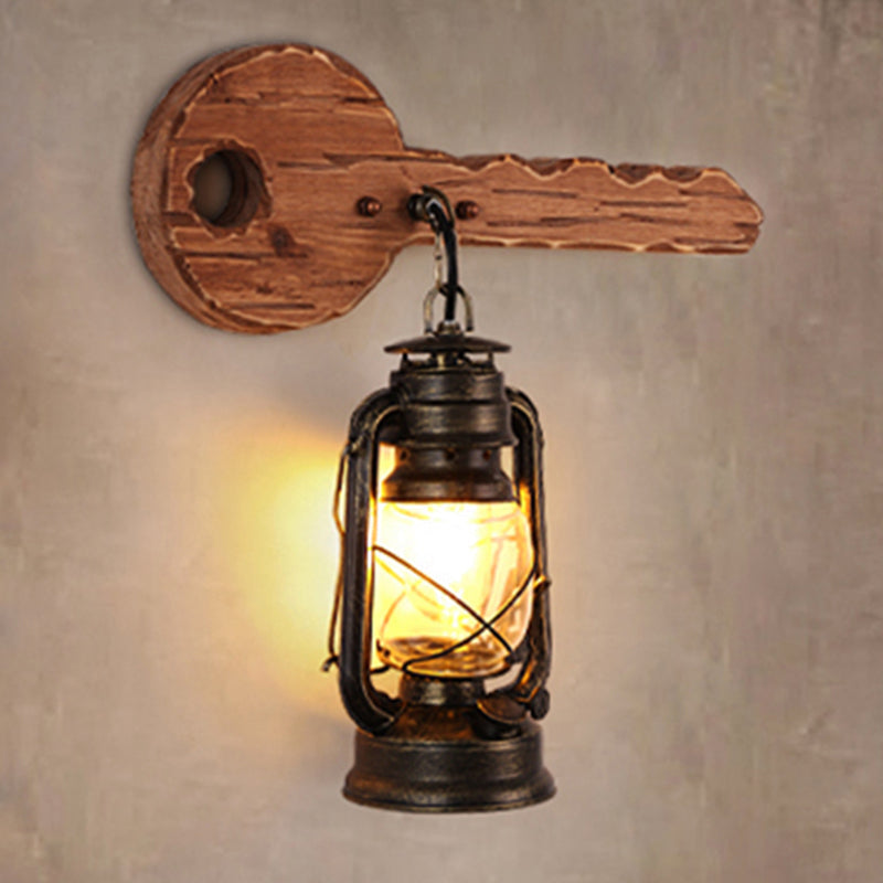 Antiqued Kerosene Wall Sconce With Clear Glass And Wood Leaf/Key Backplate For Dining Room Lighting