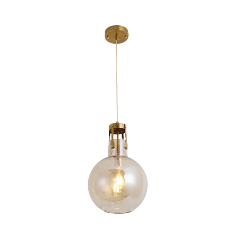 Postmodern Brass Pendant Lamp with Cognac Glass Shade - Bedside Lighting Solution