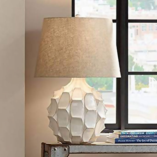 Rustic Pinecone Ceramic Nightstand Lamp With Tapered Drum Shade - White