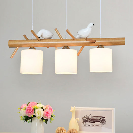 Wooden Hanging Chandelier With 2/3 Lights Glass Cylinder Shade And Bird Décor - Ideal For Dining