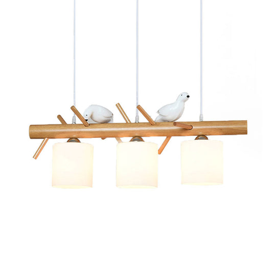 Wooden Hanging Chandelier With 2/3 Lights Glass Cylinder Shade And Bird Décor - Ideal For Dining