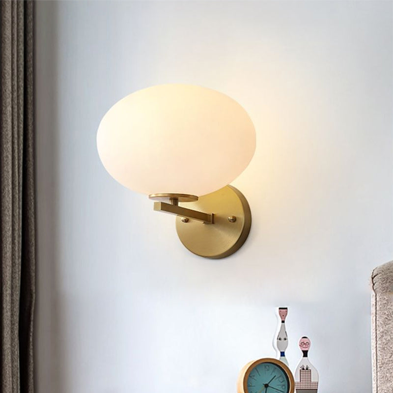 Modern Milk Glass Wall Sconce With Brass Finish