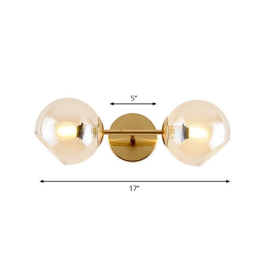 Modernist Gold Wall Lamp With Clear Glass Shade - 2 Lights Spherical Mount Fixture