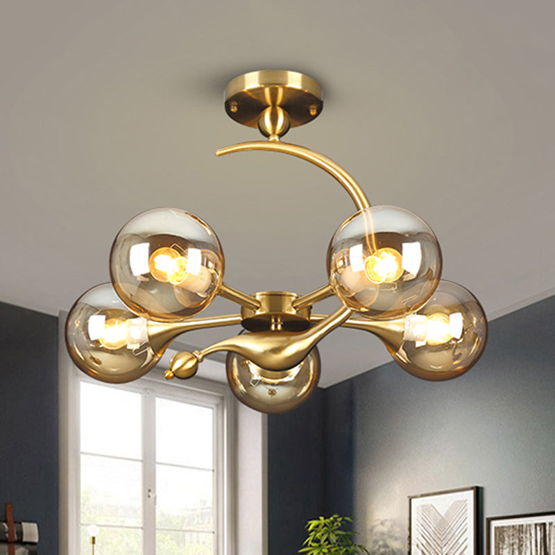 Burst Amber Glass Orb Semi Flush Chandelier - Postmodern 3/5 Heads Brass Ceiling Mounted Light with Curved Arm