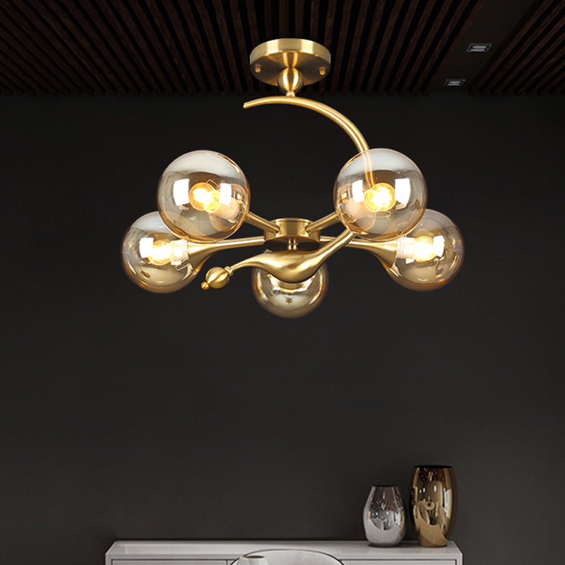 Burst Amber Glass Orb Semi Flush Chandelier - Postmodern 3/5 Heads Brass Ceiling Mounted Light with Curved Arm