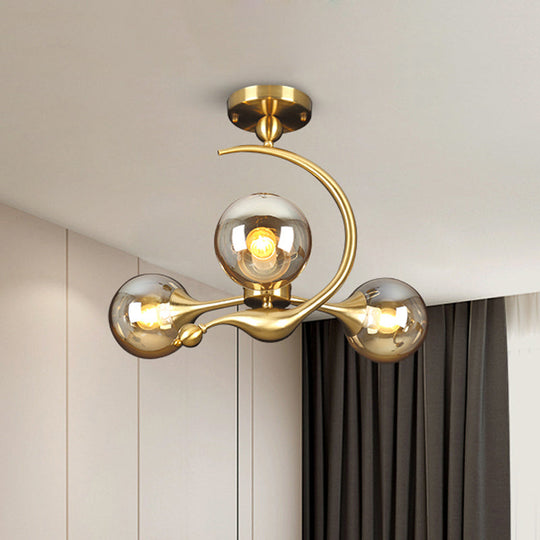 Burst Amber Glass Orb Semi Flush Chandelier - Postmodern 3/5 Heads Brass Ceiling Mounted Light with Curved Arm