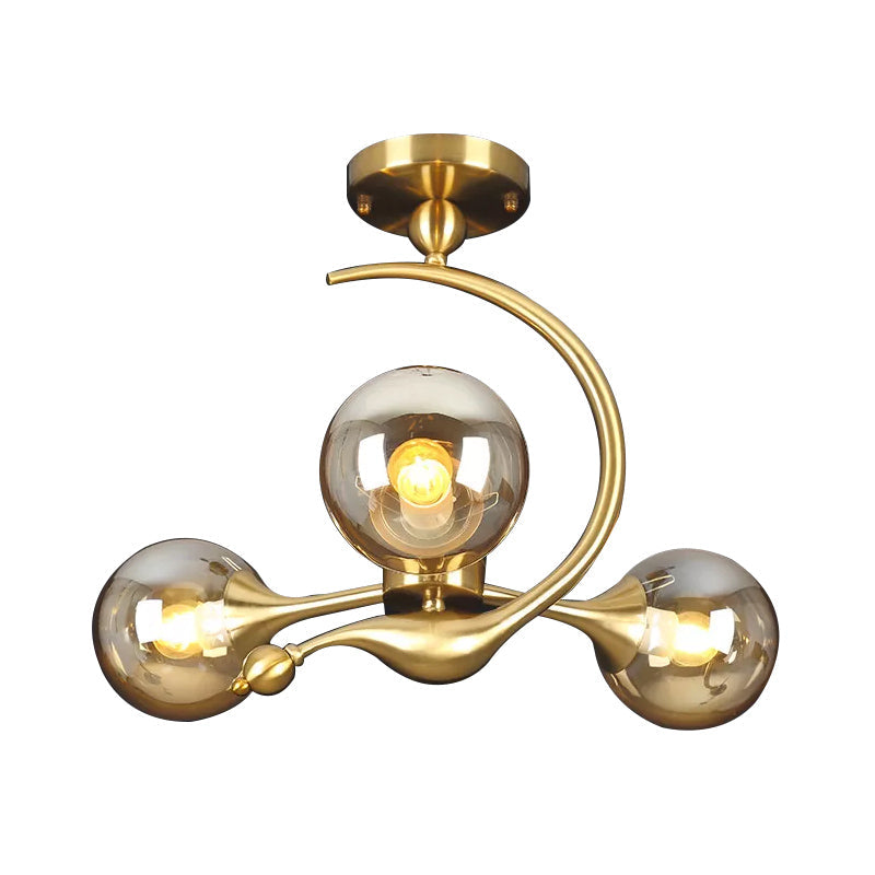 Burst Amber Glass Orb Semi Flush Chandelier - Postmodern 3/5 Heads Brass Ceiling Mounted Light with Curved Arm