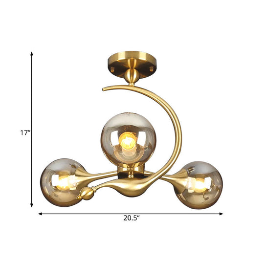 Burst Amber Glass Orb Semi Flush Chandelier - Postmodern 3/5 Heads Brass Ceiling Mounted Light with Curved Arm