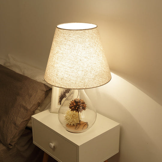 Contemporary Clear Waterdrop Glass Table Lamp With Floral Decor And Fabric Shade