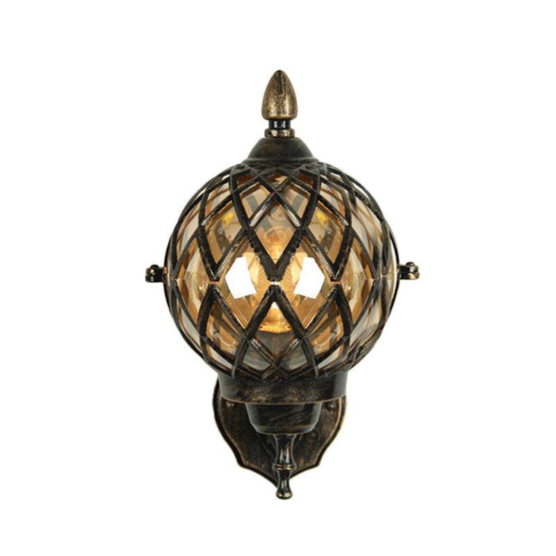 Amber Glass Wall Sconce With Industrial Cage And Black Globe For Dining Room Lighting