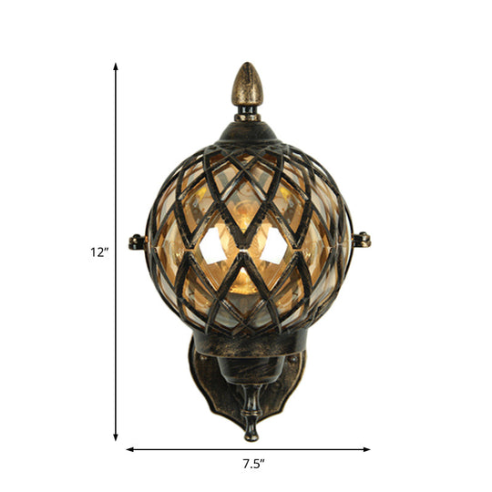 Amber Glass Wall Sconce With Industrial Cage And Black Globe For Dining Room Lighting