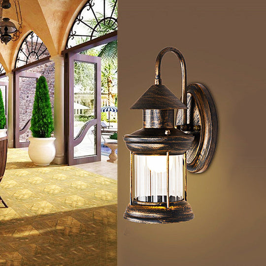 Coastal Brass Metallic Lantern Wall Mount Lamp With Curvy Arm - 1 Bulb Sconce