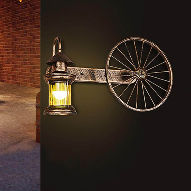 Coastal Brass Amber Glass Wall Sconce With Wagon Wheel Deco