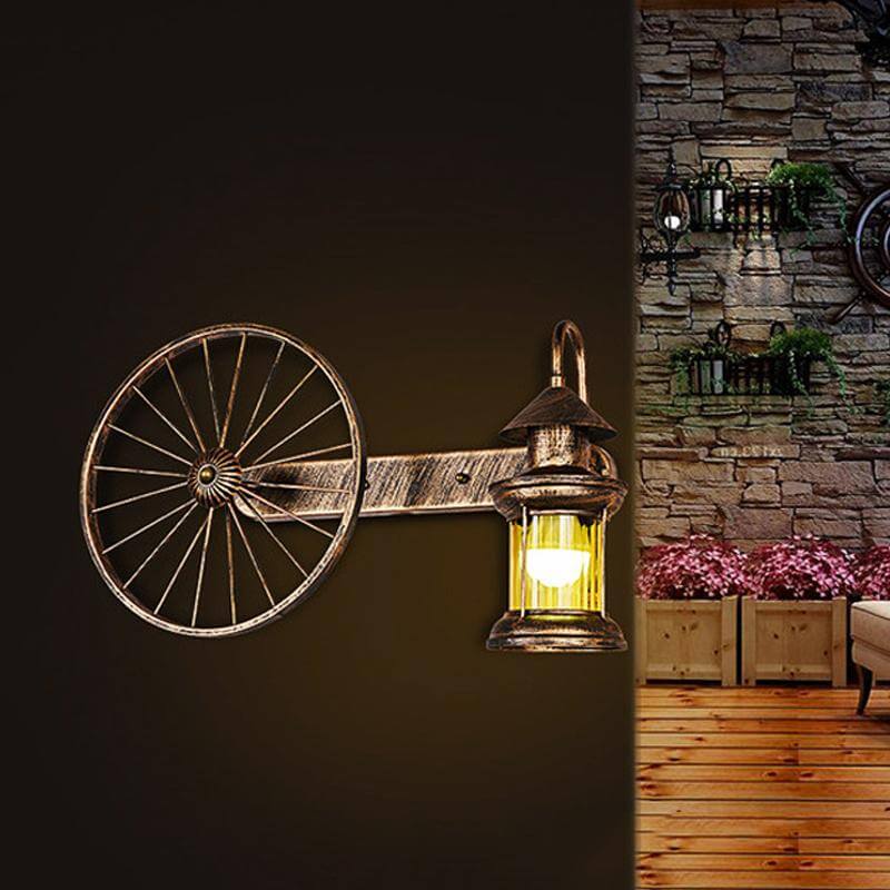 Coastal Brass Amber Glass Wall Sconce With Wagon Wheel Deco