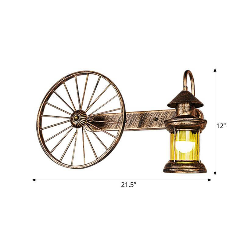 Coastal Brass Amber Glass Wall Sconce With Wagon Wheel Deco