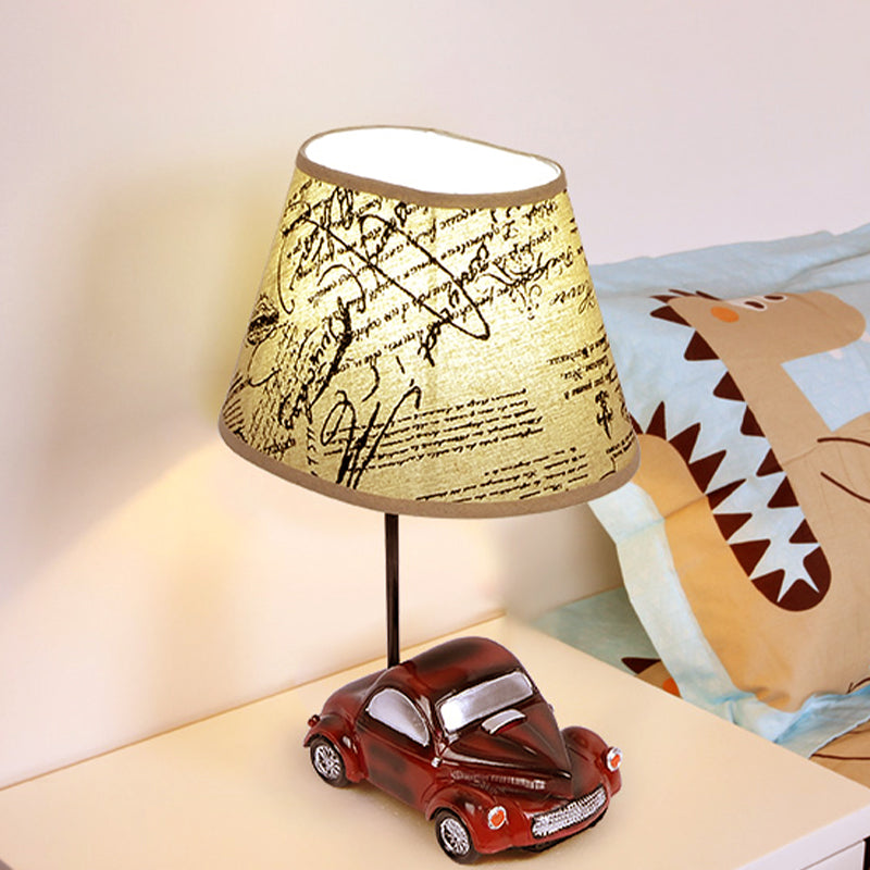 Kids Beige Barrel Night Table Lamp With Car Base - 1-Light Fabric Bedroom Nightstand Light