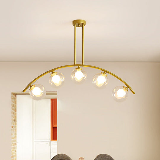 Modern Glass Orb Island Pendant Light With Brass Arch Arm - 5 Bulbs White/Clear Design For Dining