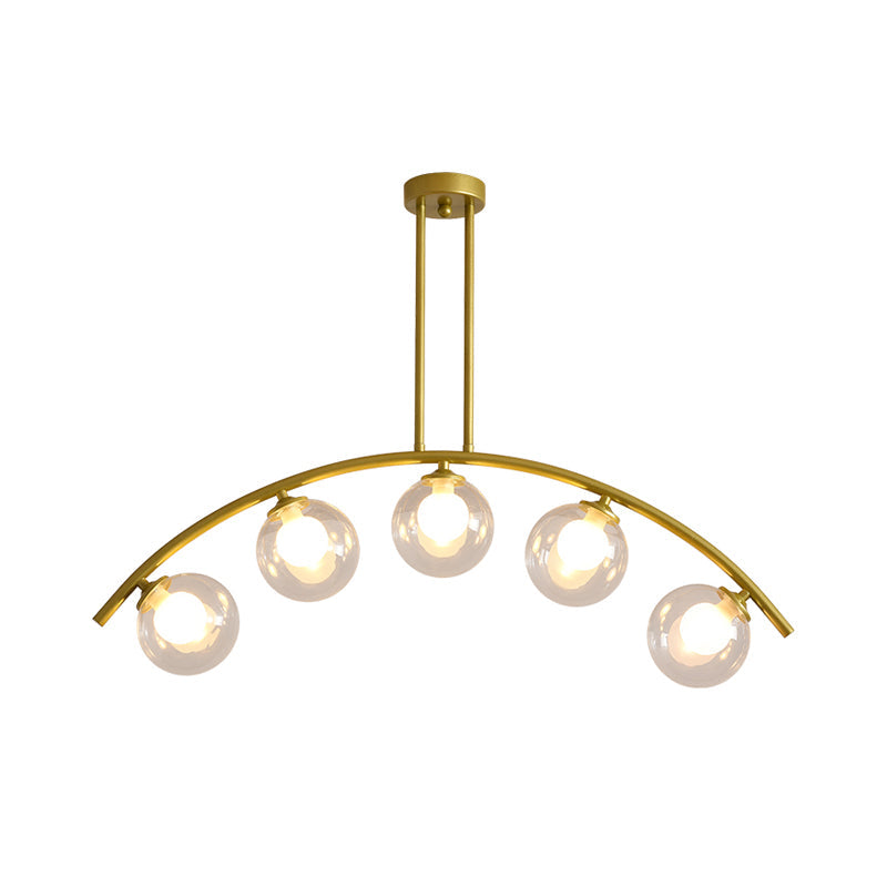 Modern Glass Orb Island Pendant Light With Brass Arch Arm - 5 Bulbs White/Clear Design For Dining