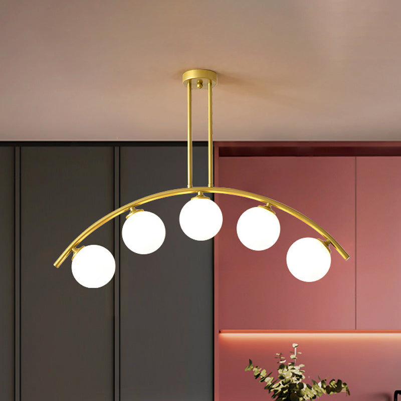 Modern Glass Orb Island Pendant Light With Brass Arch Arm - 5 Bulbs White/Clear Design For Dining