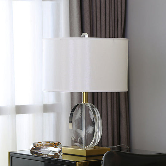 Traditional Nightstand Lamp With White Fabric Cylinder Shade And Clear Circular Crystal Accent