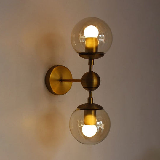 Post Modern Amber Glass Globe Wall Sconce With Brass Mount - 1/2 Light