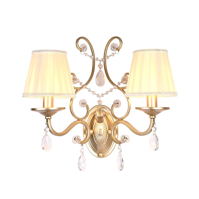 Contemporary Crystal Wall Sconce With Curved Arm And Brass Finish