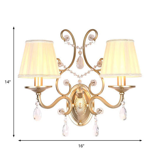 Contemporary Crystal Wall Sconce With Curved Arm And Brass Finish