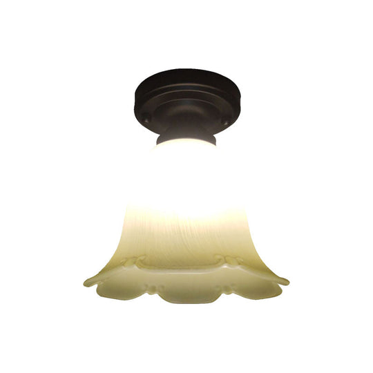 White Glass Flush Mount Ceiling Light With Black Base And Cottage Flower Design