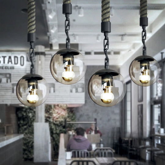 Stylish Black Ball Pendant Light with Tan Glass, Perfect for Lodge, Restaurant or Home Decor