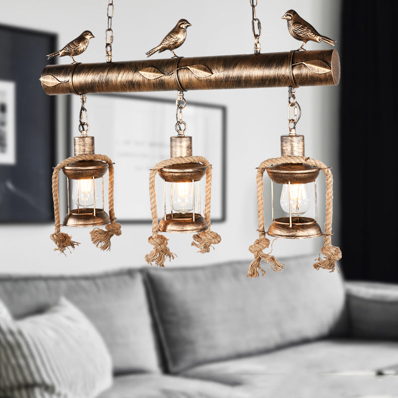 Antique Brass Lantern Pendant With Clear Glass And Bird Accent - 3-Light Coastal Island Kit