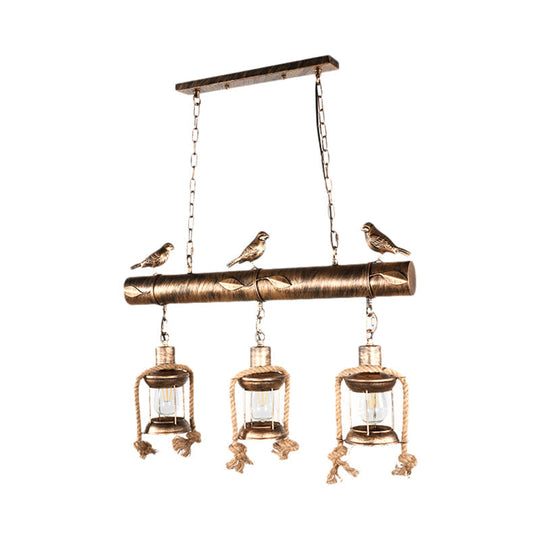 Antique Brass Lantern Pendant With Clear Glass And Bird Accent - 3-Light Coastal Island Kit