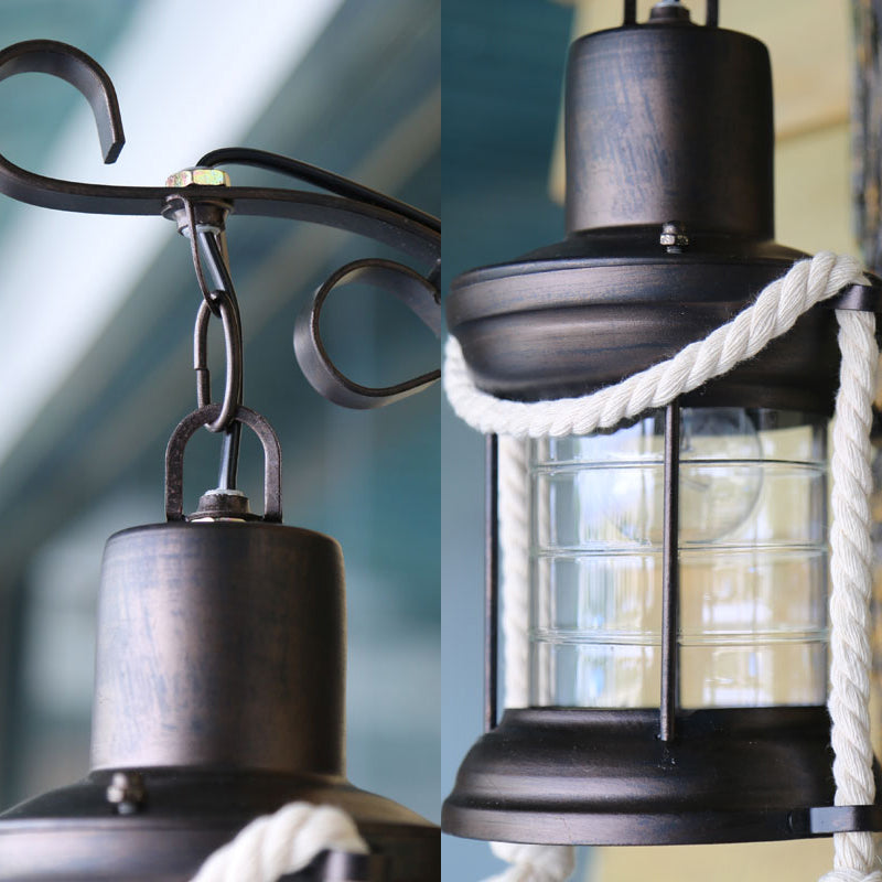 Coastal Black Kerosene Sconce With Clear Glass Bulb And Wooden Backplate For Outdoor Lighting