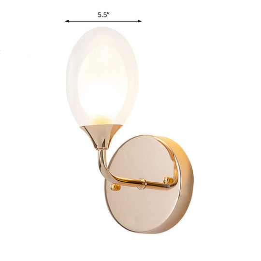 Modern Brass Wall Sconce With Clear Glass Shade - Oval Design For Dining Room