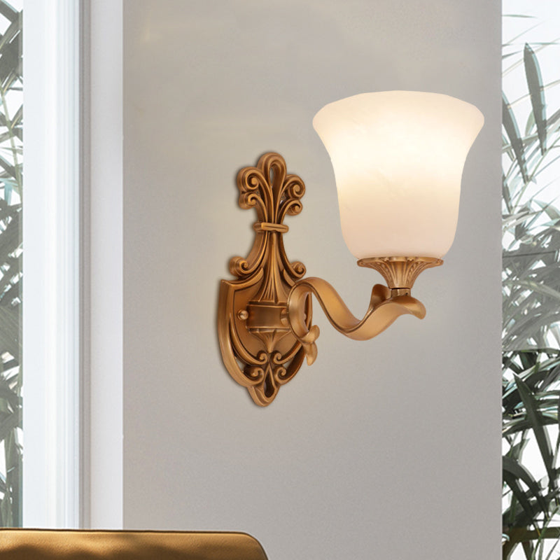 Countryside Opal Glass Wall Sconce With Brass Finish And Curvy Arm