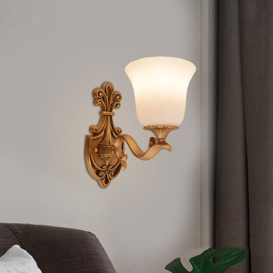 Countryside Opal Glass Wall Sconce With Brass Finish And Curvy Arm