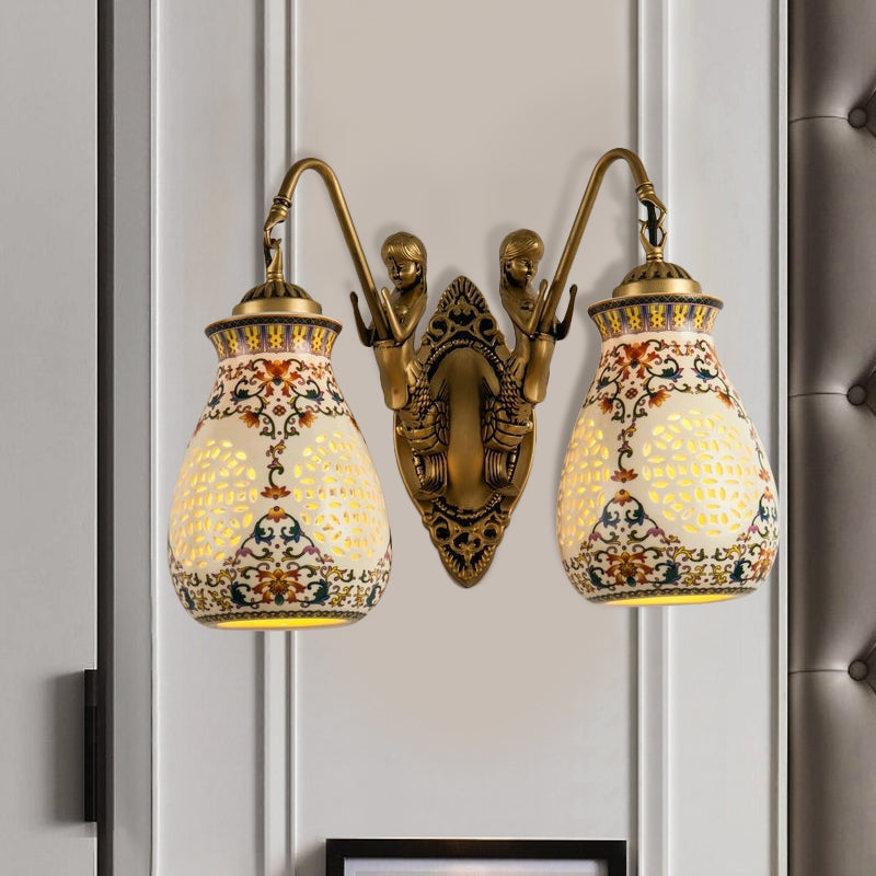 Antique Brass Ceramic Wall Sconce With Pierced Jar Traditional Patterned Design And Small Mermaid