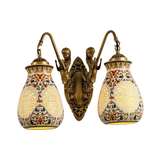 Antique Brass Ceramic Wall Sconce With Pierced Jar Traditional Patterned Design And Small Mermaid