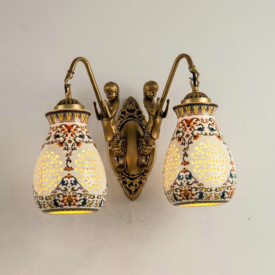 Antique Brass Ceramic Wall Sconce With Pierced Jar Traditional Patterned Design And Small Mermaid