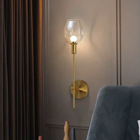 Minimalist Gold Sconce Wall Light With Clear Dimpled Cup And Pencil Arm For Hallway