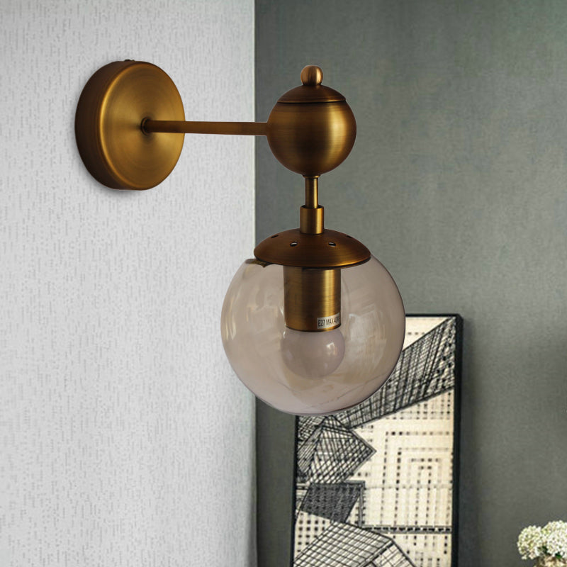 Post Modern Amber Glass Globe Wall Sconce With Brass Mount - 1/2 Light