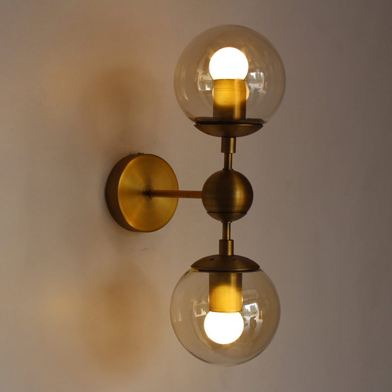 Post Modern Amber Glass Globe Wall Sconce With Brass Mount - 1/2 Light