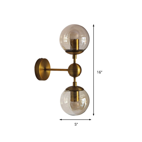 Post Modern Amber Glass Globe Wall Sconce With Brass Mount - 1/2 Light