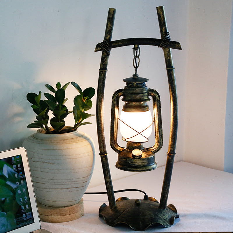 Opal Glass Kerosene Table Light With Antiqued Brass Frame And Farmhouse-Inspired Design