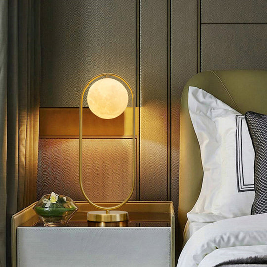 Minimalist Gold Metal Nightstand Lamp With Moon Glass Shade