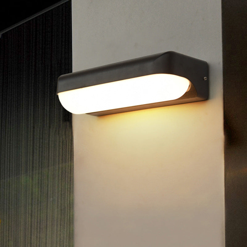 Modern Black Acrylic Wall Sconce With Flush Capsule Design And Half-Bulb Mounting