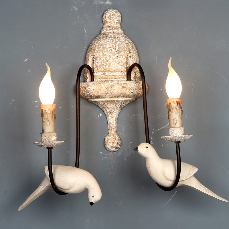 Rustic Wood Swooping Arm Wall Lamp With Distressed White Sconce - Decorative Candle And Bird Accents