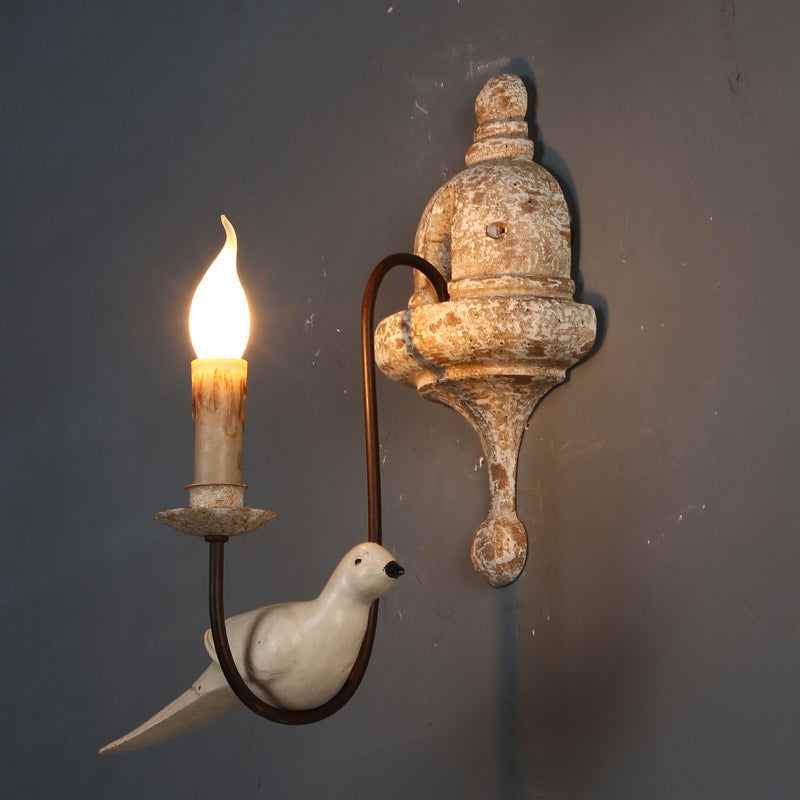 Rustic Wood Swooping Arm Wall Lamp With Distressed White Sconce - Decorative Candle And Bird Accents