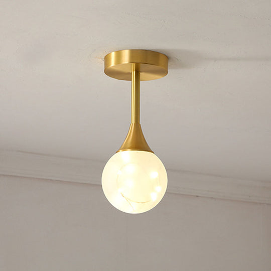 LED Starry Pendant Chandelier: Simple Brass Sphere Design with Glass Shade