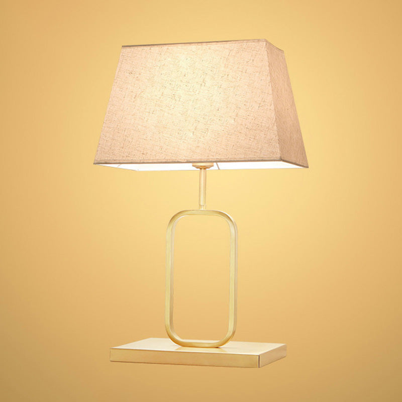 Modern Gold Bedside Table Lamp With Rounded Rectangle Shape And Fabric Shade